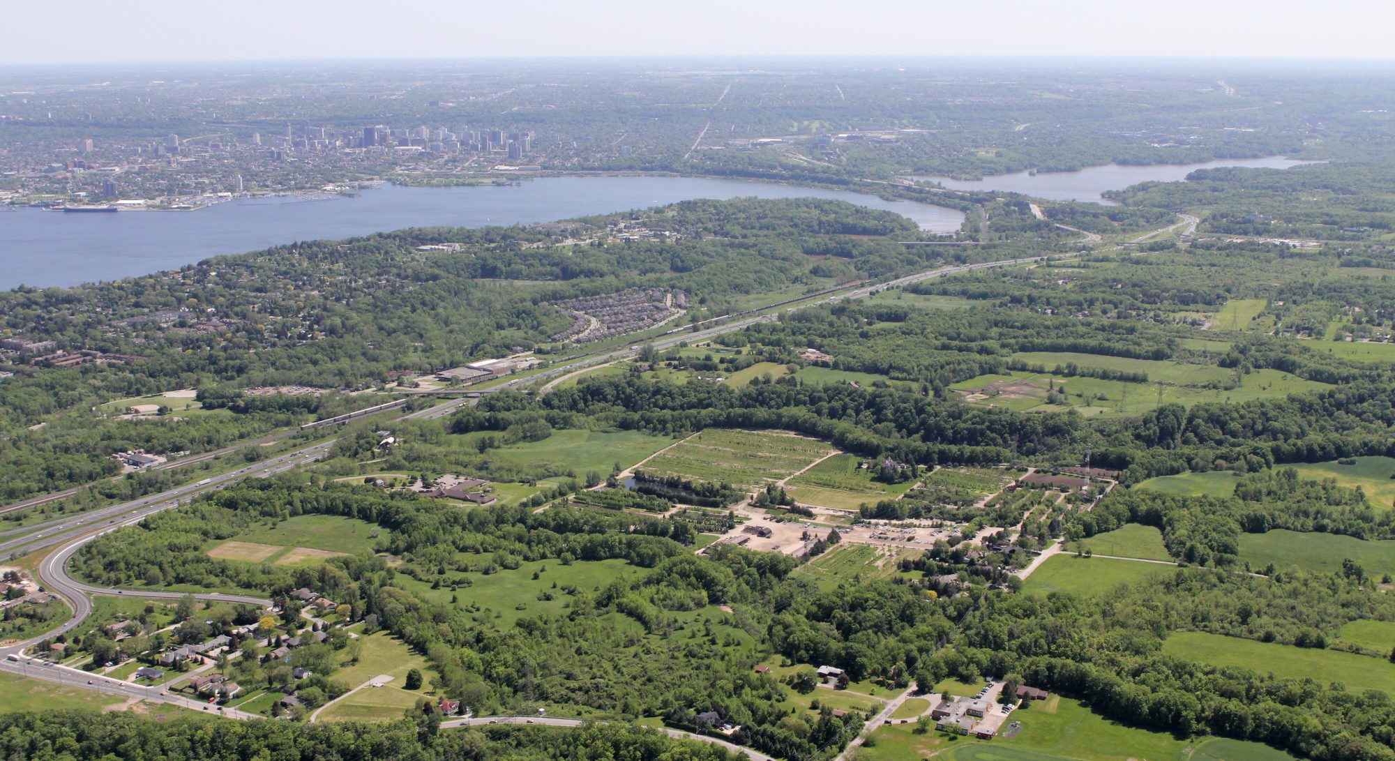 Aerial drone image of residential communities and natural areas in part of the Conservation Halton watershed. 