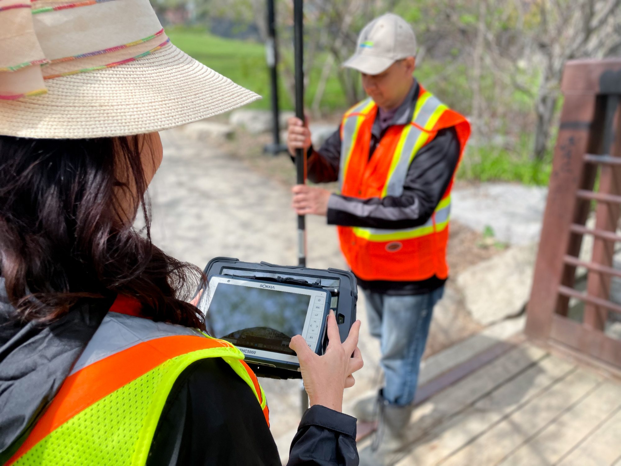 Two employees conduct ecological monitoring.