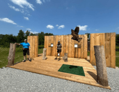 Wonders of Raptors Show: a bird is flying freely with trainers